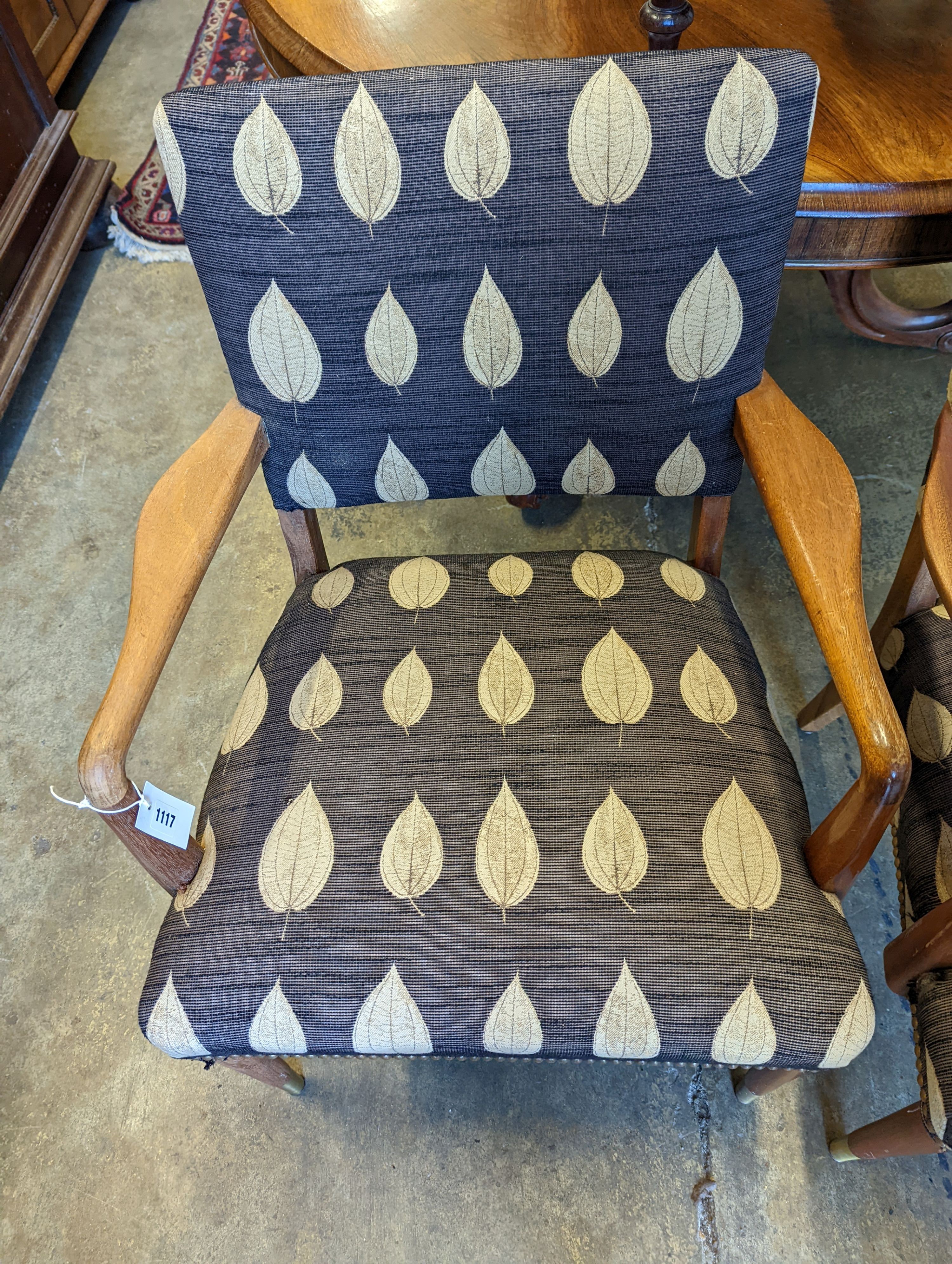 A pair of mid century Danish design teak elbow chairs, width 60cm, depth 54cm, height 83cm